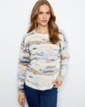 Featuring a plush knit texture, this sweater offers a cozy feel with its soft fabric and relaxed fit. By Charlie B.