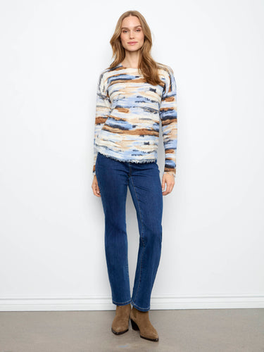 Distressed edges add a touch of edgy style to this comfortable and fashionable piece. By Charlie B.