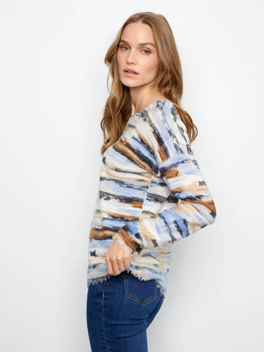 Drop shoulders offer an easygoing vibe that pairs well with jeans or skirts for a laid-back ensemble. By Charlie B.