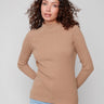Truffle sweater featuring a stylish mock neck and ribbed knit texture, perfect for a chic look by Charlie B.