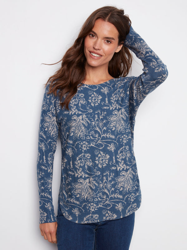 Calico blue sweater featuring a stylish boat neck and abstract floral design for a chic look by Charlie B.
