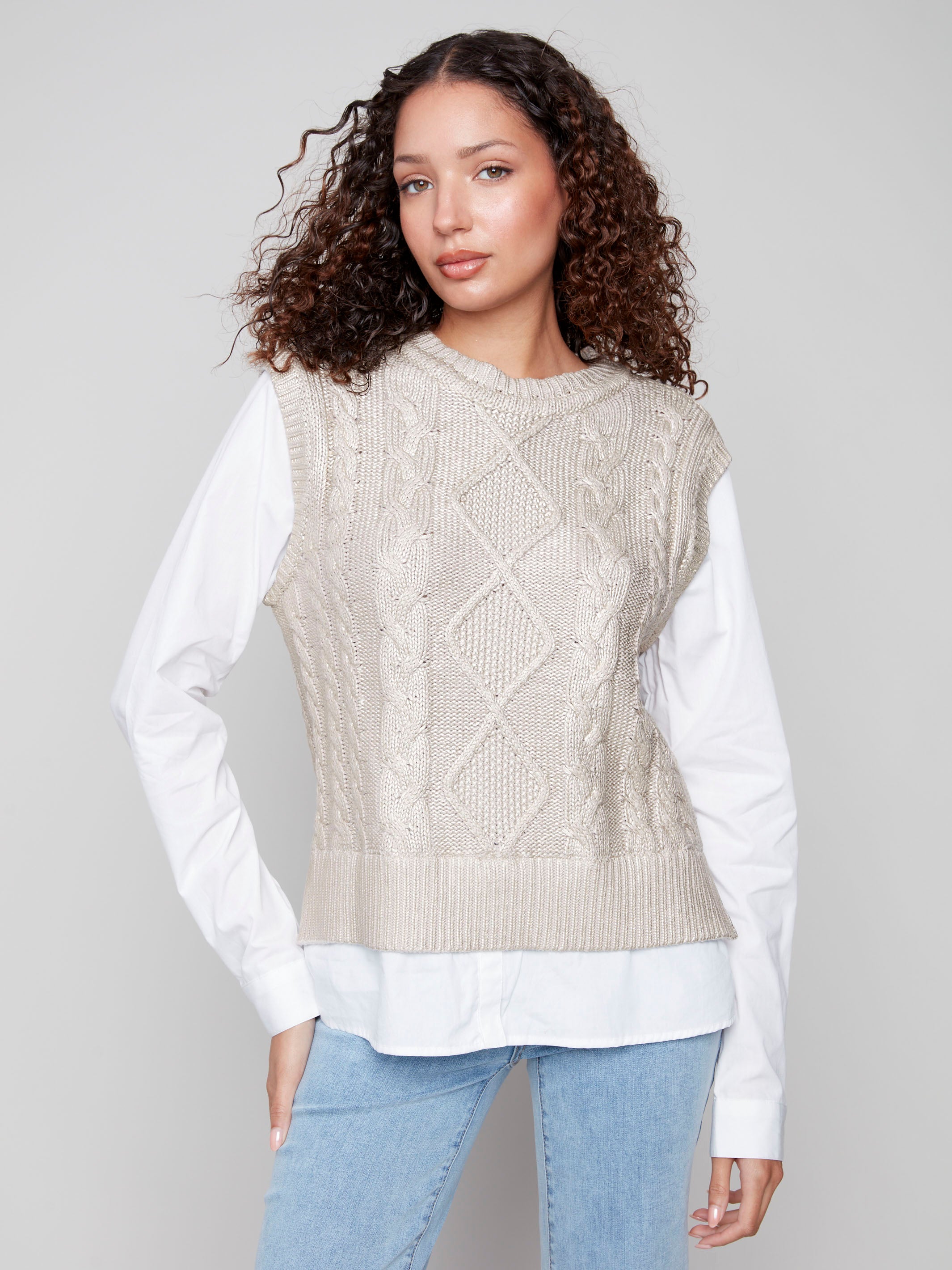 Elegant sleeveless sweater vest with a foiled cable knit pattern, showcasing a classic crew neck style by Charlie B.