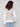 Sophisticated sleeveless vest with an elegant cable knit and modern layered look for versatile styling by Charlie B.