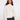 Ecru jacquard sweater featuring a mock neck and ribbed hem, highlighted by subtle metallic detail. Perfect for winter outings by Charlie B.