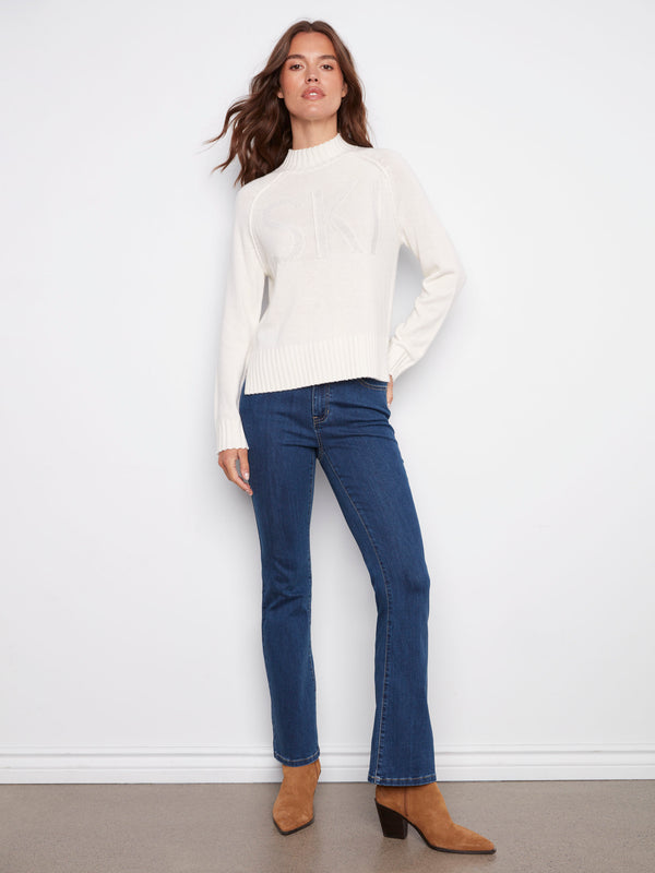 Ecru sweater with mock neck design, complemented by raglan sleeves for an elegant silhouette. Ideal for casual wear by Charlie B.