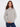 Heather light grey sweater featuring a mock neck and PEACE jacquard pattern, crafted with ribbed hem for a cozy fit by Charlie B.
