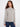 Heather grey sweater featuring raglan sleeves and elegant PEACE jacquard pattern for versatile styling options by Charlie B.