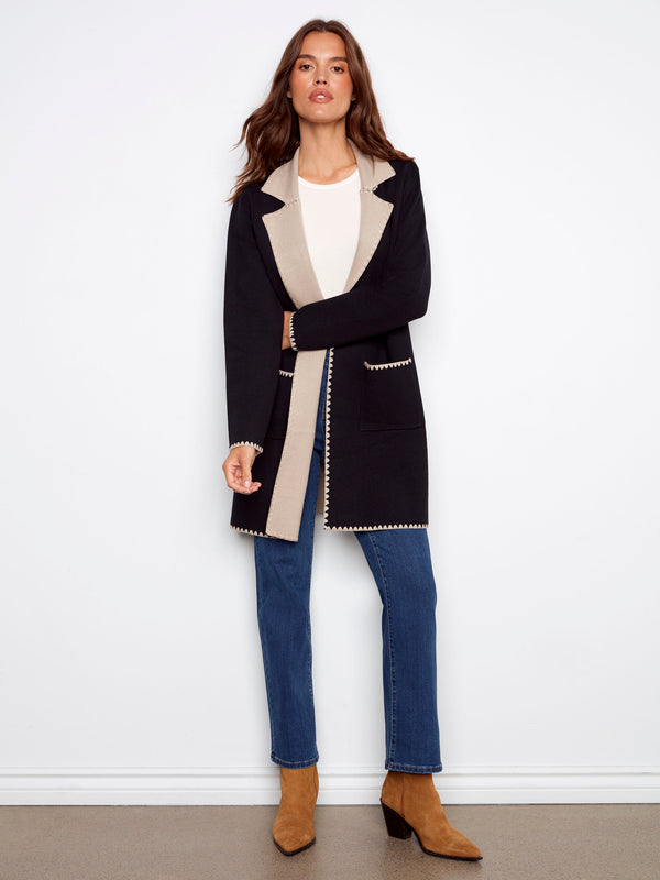 This black cardigan showcases an open front design, perfect for layering by Charlie B.