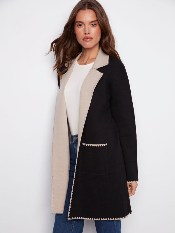 Chic black cardigan with intricate blanket stitch detail adding a unique touch by Charlie B.