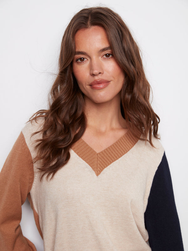 Fashion-forward colorblock design adds a modern touch to any outfit by Charlie B.