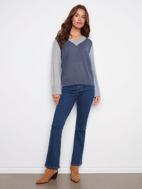 Chic sweater with wide cuffs and a unique colorblock design for added flair by Charlie B.