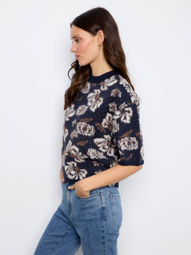 Elegant balloon elbow sleeves add a unique flair to this floral knit sweater, ideal for relaxed styling by Charlie B.