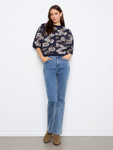 Chic mock neck sweater with an intricate floral pattern, combining elegance with everyday comfort by Charlie B.