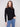 Textured black sweater with blue jeans, highlighting its elegant slim fit design by Charlie B.