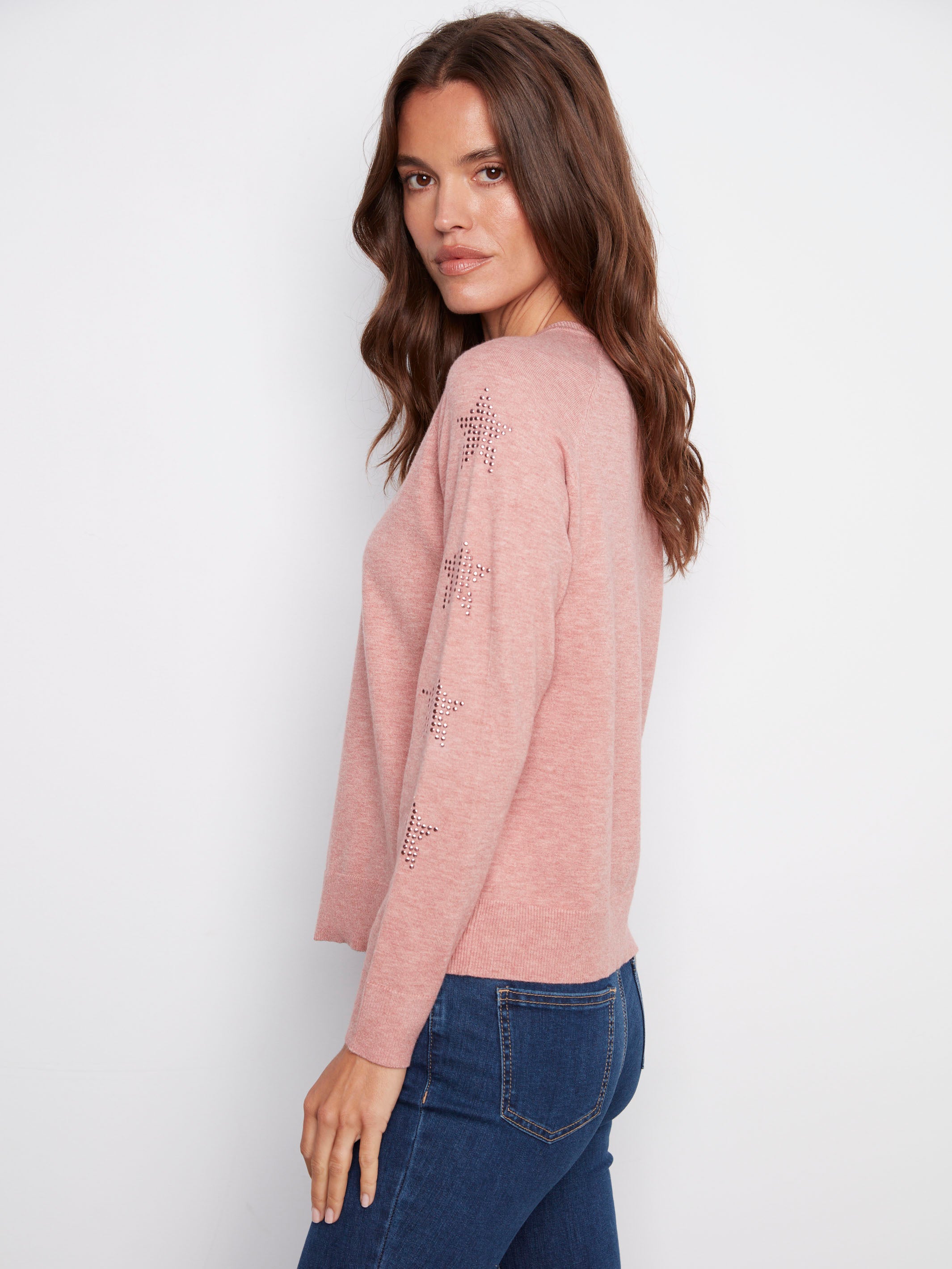 Chic primrose sweater adorned with star stud details on the sleeves, creating a unique and fashionable look by Charlie B.
