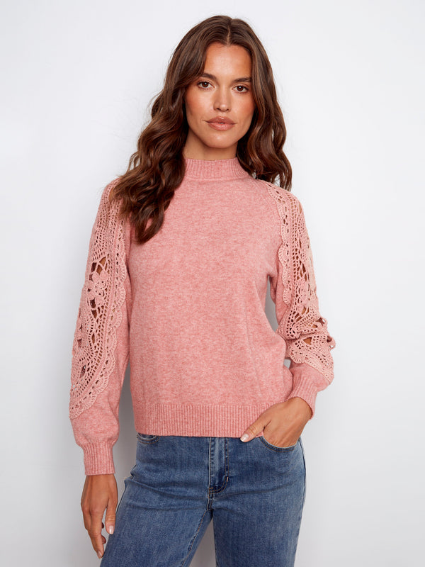 With detailed crochet sleeves, the primrose sweater brings elegance to any ensemble effortlessly by Charlie B.