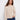 Heather oat sweater featuring a cozy mock neck design with wide cuffs for added style by Charlie B.