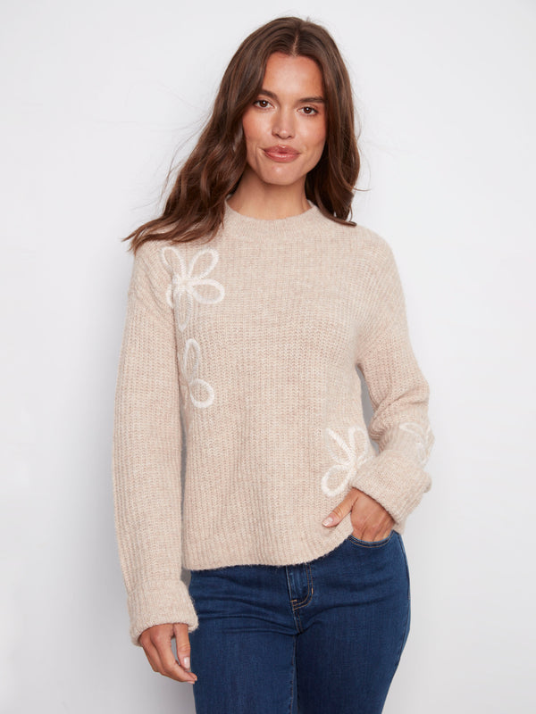 Heather oat sweater featuring a cozy mock neck design with wide cuffs for added style by Charlie B.