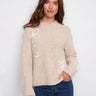 Heather oat sweater featuring a cozy mock neck design with wide cuffs for added style by Charlie B.