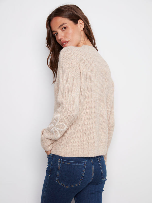 Wide cuffs add a touch of sophistication to this heather oat mock neck sweater by Charlie B.