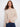 Charming floral soutache details elevate the look of this versatile heather oat sweater by Charlie B.