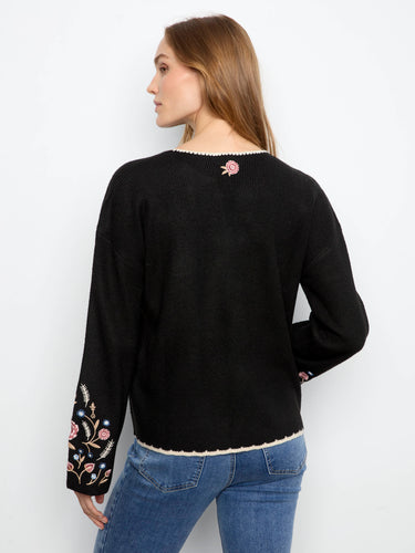Chic black sweater adorned with embroidered floral details and crafted in ribbed fabric by Charlie B.