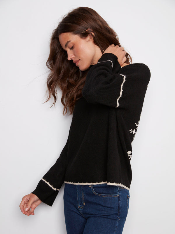 Stylish black long-sleeve sweater with notched neckline and exquisite white detailing by Charlie B.