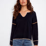 Navy sweater featuring drop shoulders and white embroidery detailing for a relaxed look by Charlie B.