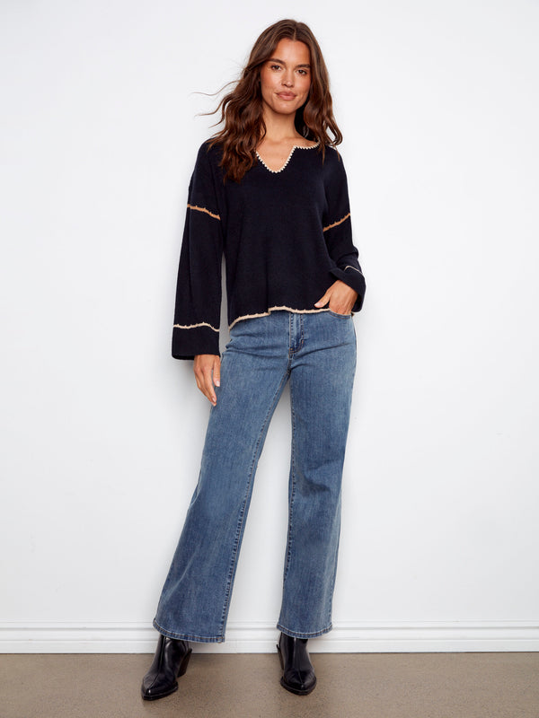Relaxed fit navy sweater with notched neckline and detailed embroidery for a chic style by Charlie B.