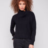Black sweater with cowl neck and drop shoulders, featuring a chevron pattern. Designed for comfort and style by Charlie B.