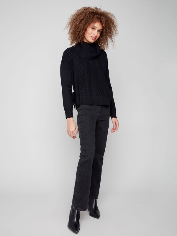 Chic black sweater featuring a side slit with tie detail, adding flair to the classic chevron pattern by Charlie B.