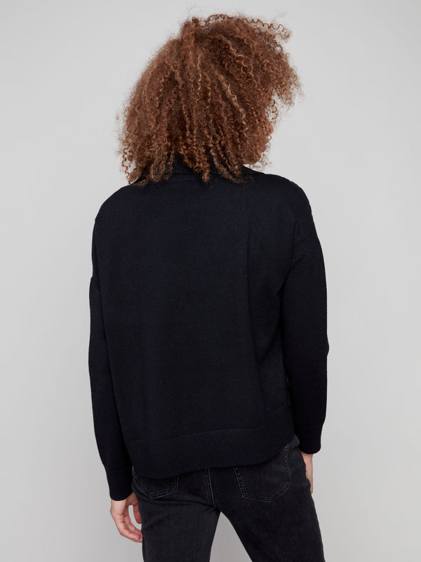 Classic black sweater designed with drop shoulders and an elegant cowl neck, perfect for versatile styling by Charlie B.