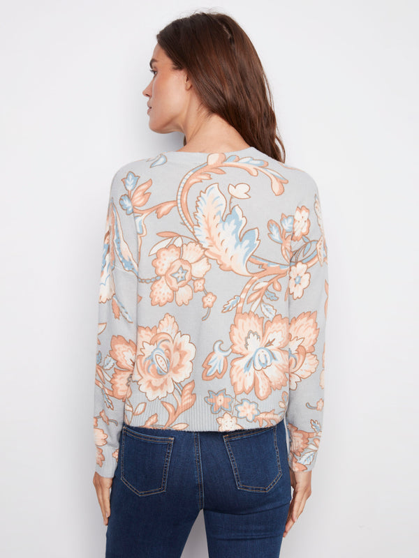 Dolman sleeves on this baroque floral printed sweater create an effortlessly chic silhouette by Charlie B.
