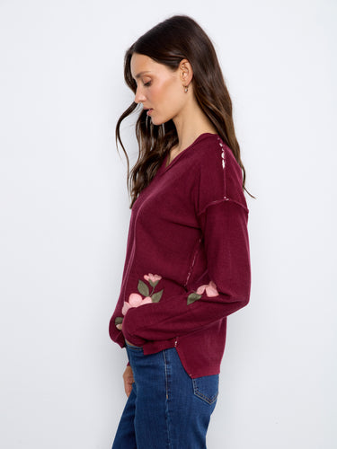 Floral print merlot sweater with reversible design and drop shoulder detail, crafted from cotton blend by Charlie B.