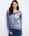 This sweater features a V-neck design with a cotton blend fabric, offering both style and comfort. By Charlie B.