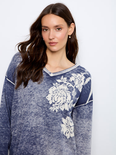 Long sleeves provide warmth and style in cooler weather with this fashionable piece. By Charlie B.