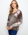 This cotton blend sweater features a stylish V-neck with drop shoulders, perfect for a relaxed yet chic look by Charlie B.