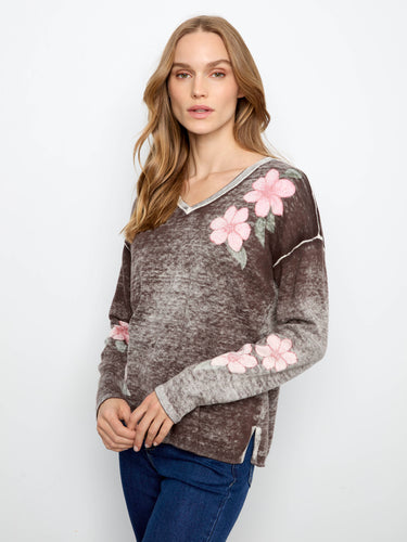 This cotton blend sweater features a stylish V-neck with drop shoulders, perfect for a relaxed yet chic look by Charlie B.
