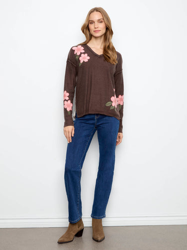 The floral print adds a touch of elegance to this V-neck sweater, making it an ideal choice for casual outings by Charlie B.