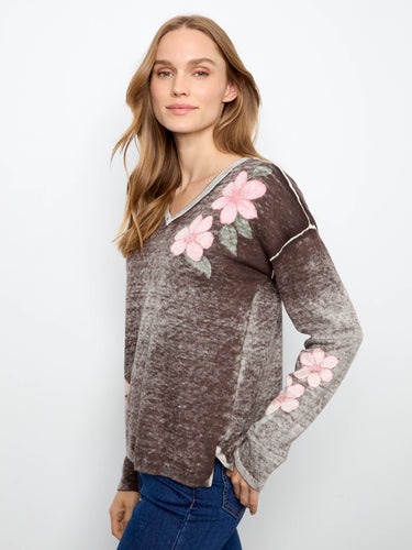 Crafted from a luxurious cotton blend, this sweater offers both comfort and style with long sleeves and floral accents by Charlie B.