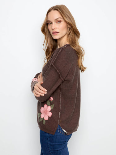 Elevate your wardrobe with this reversible print top featuring beautiful floral details and drop shoulders by Charlie B.