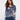 Denim blue sweater with a relaxed fit and floral accents, showcasing long sleeves for a cozy feel, by Charlie B.