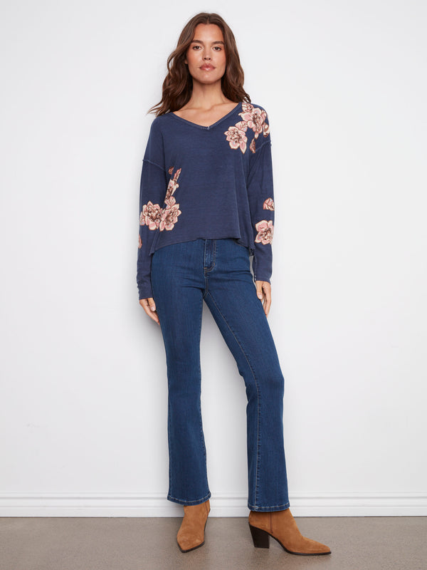 Comfortable long-sleeve sweater with floral details and a relaxed fit in denim blue, perfect for layering, by Charlie B.
