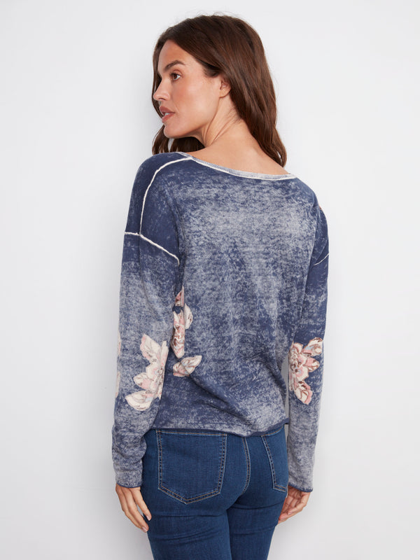 Chic reversible V-neck sweater in denim blue with delicate floral patterns and cozy long sleeves, by Charlie B.