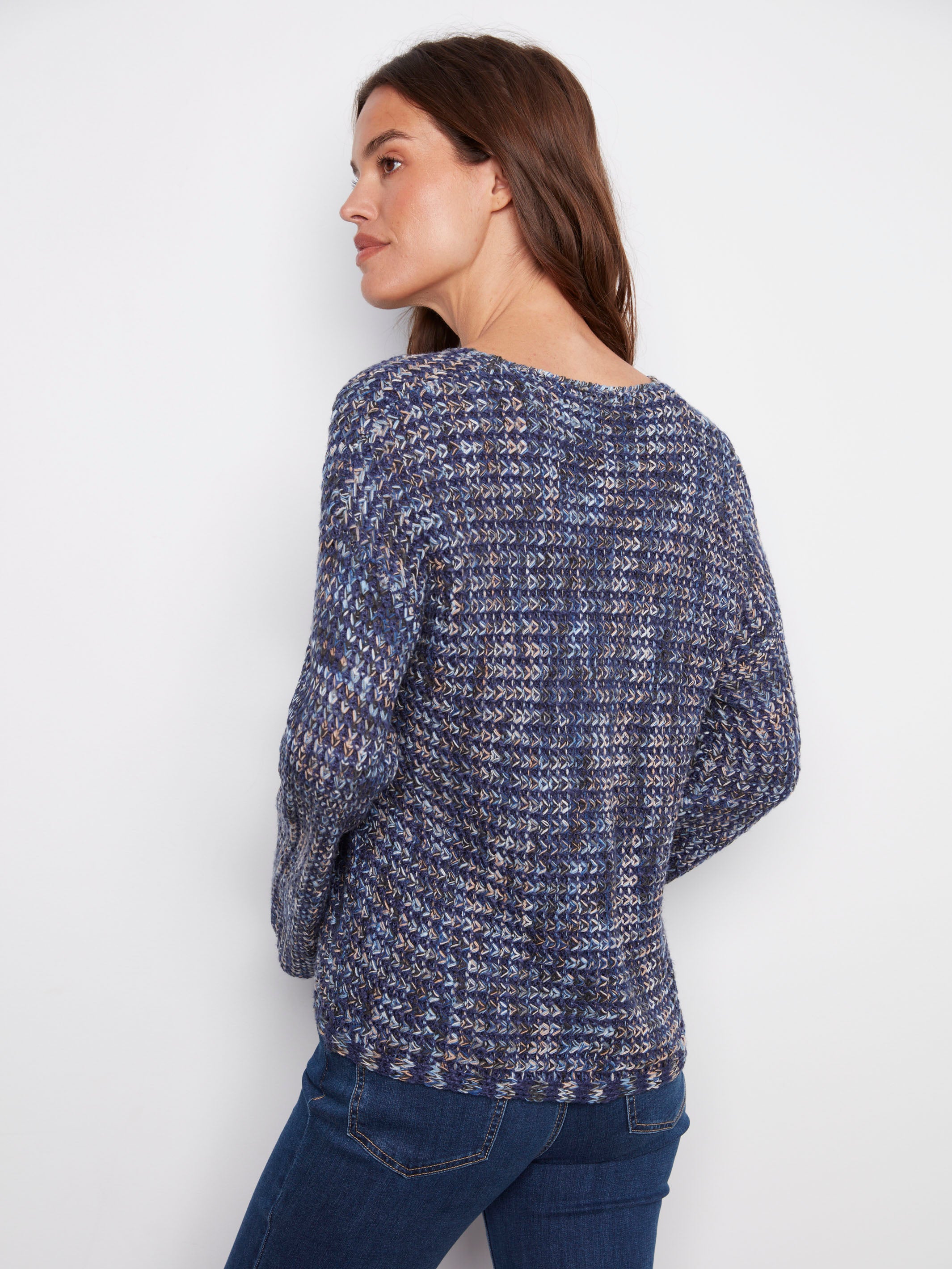 Chic blue multi-tone sweater crafted from crochet novelty yarn, designed with attention to detail and style by Charlie B.