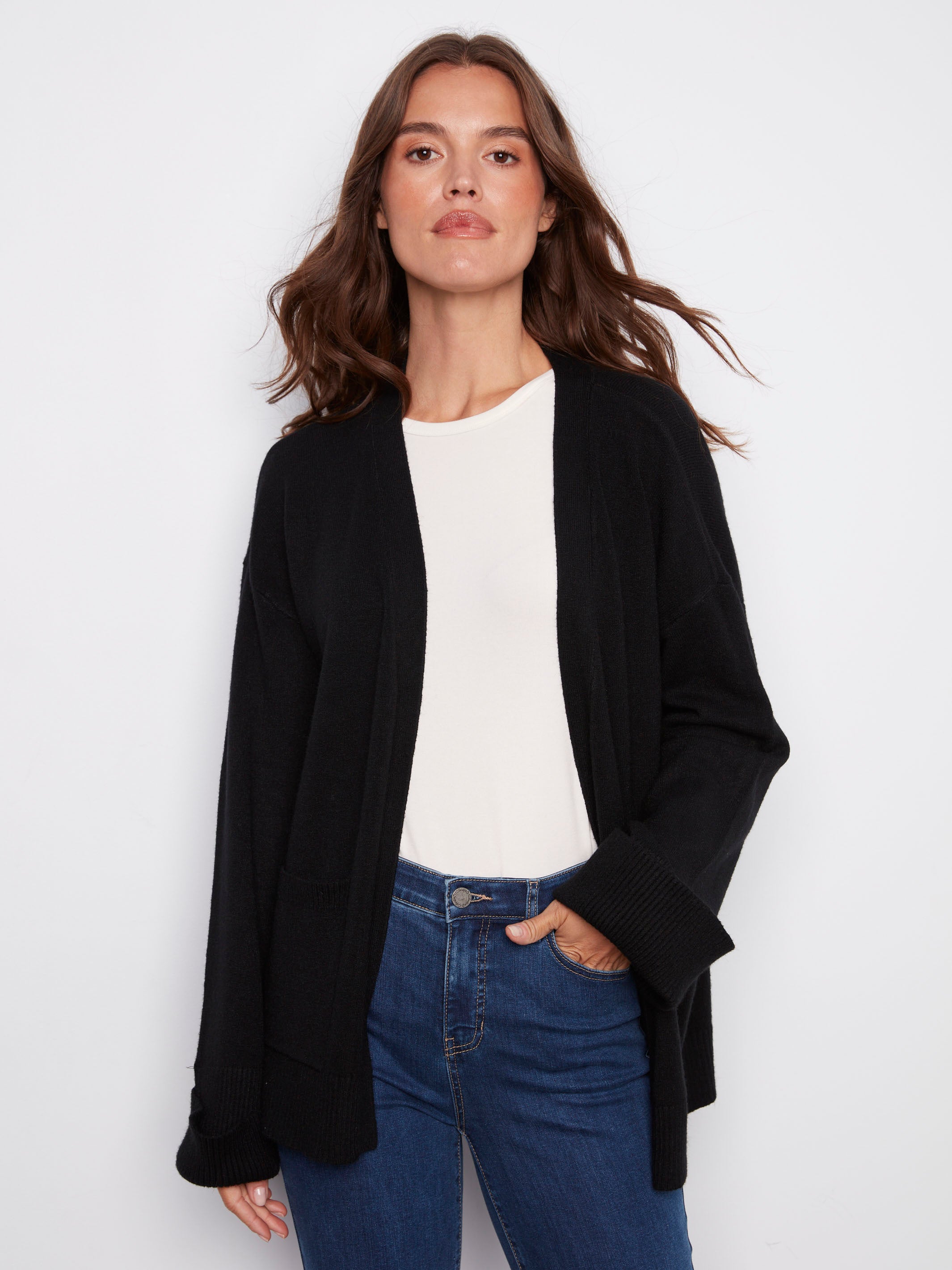 Black cardigan featuring wide cuffs for a modern touch, perfect for layering and adding style to any outfit by Charlie B.