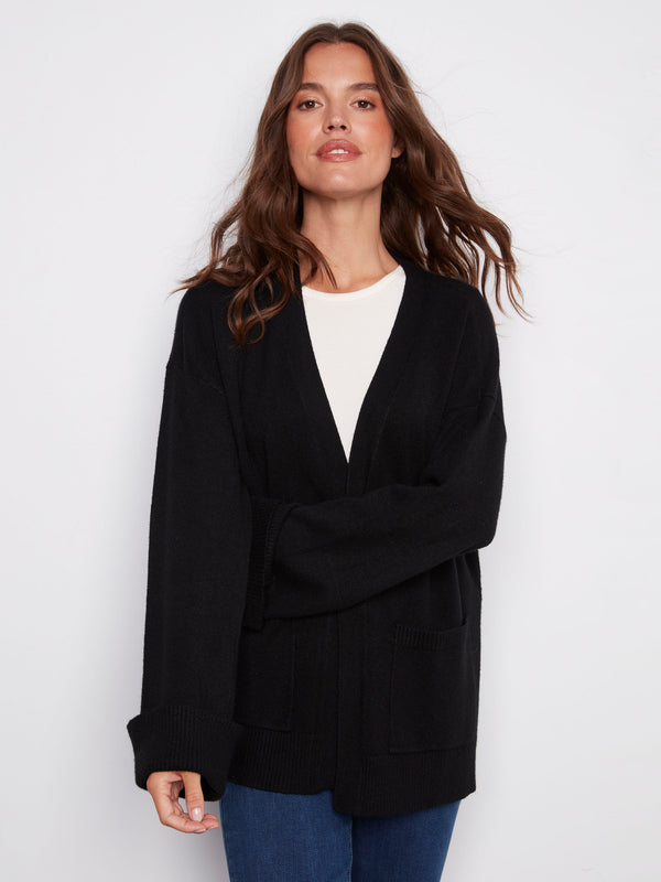 Versatile black cardigan featuring patch pockets, perfect for keeping essentials close at hand by Charlie B.