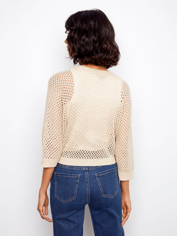Lightweight fishnet shrug featuring subtle metallic effect, adding elegance to your outfit by Charlie B.