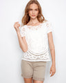 Enjoy the versatility of this reversible design crochet top in pure cotton. Perfect for any occasion with its unique pattern by Charlie B.