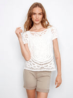 Enjoy the versatility of this reversible design crochet top in pure cotton. Perfect for any occasion with its unique pattern by Charlie B.